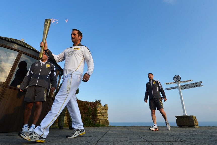 British Olympic sailor Ben Ainslee begins the torch's journey in Cornwall.