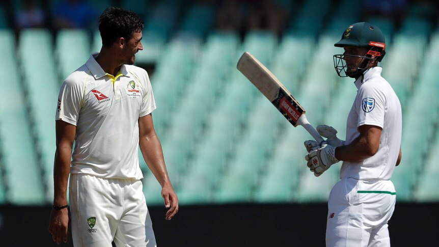 Australia's Mitchell Starc (L), exchanges words with South Africa's Theunis de Bruyn in Durban.