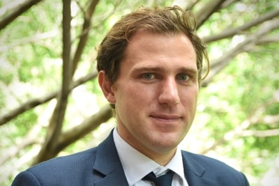 A portrait of Dirk van der Kley standing in front of a tree.