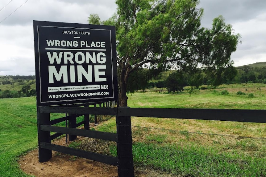 A protest sign against Anglo American's Drayton South mine near Muswellbrook