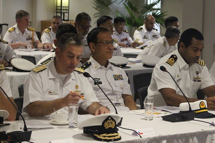 Navy admirals and senior officials sit during the presentation