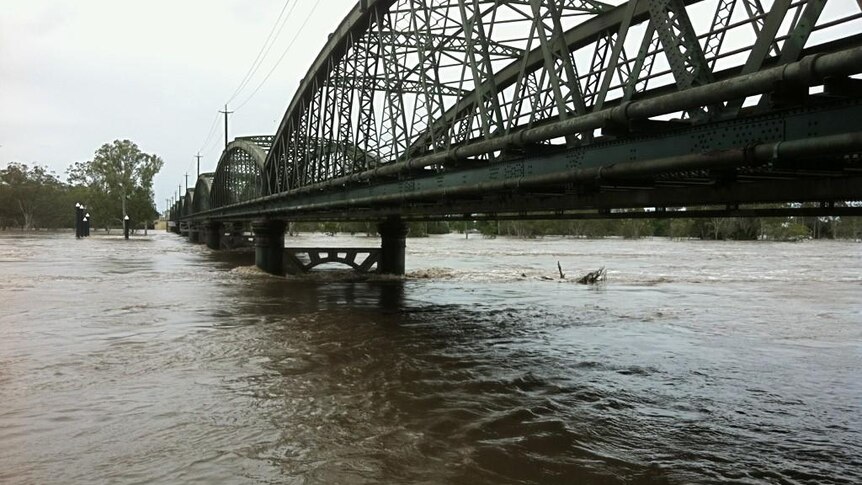 Floodwaters rise under Bundaberg's Burnett Bridge