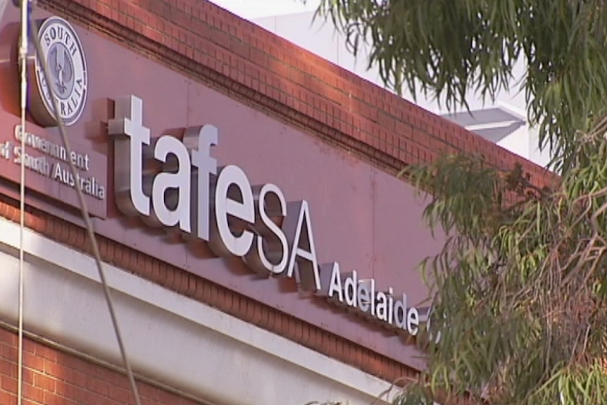 TAFE SA signage on a brick wall.