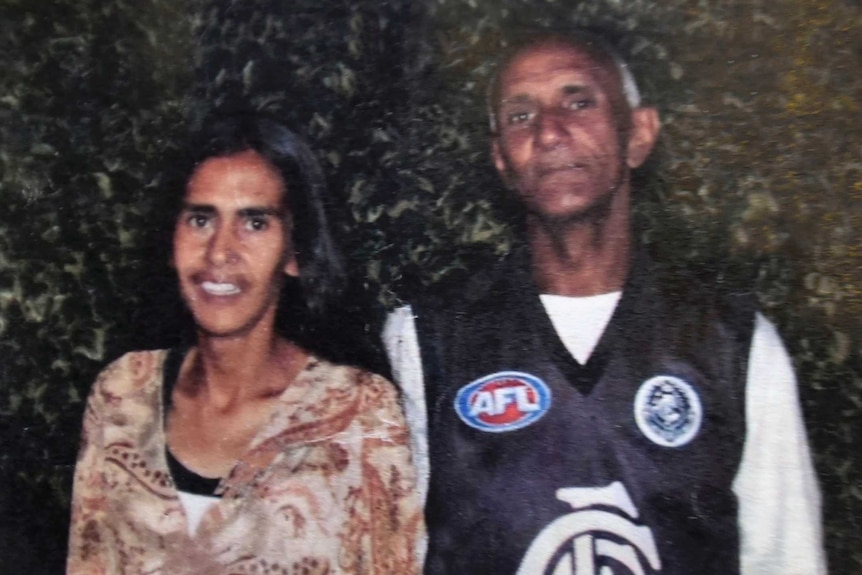 a man and a woman pose for a portrait