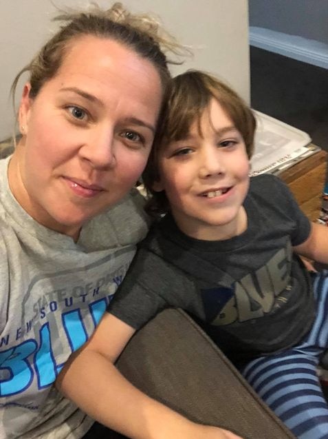 Kate Herring sitting with her son Angus