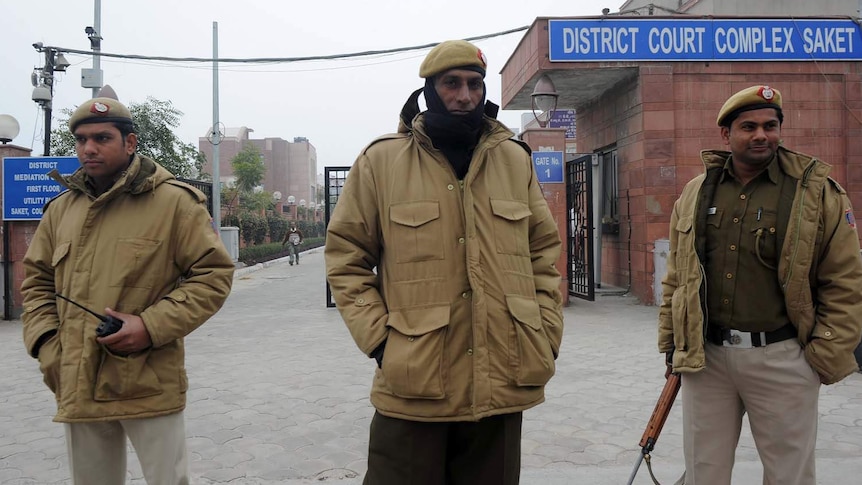 Police stand outside the District Court Saket in New Delhi