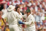 Glenn McGrath and Adam Gilchrist celebrate the wicket of Kevin Pietersen