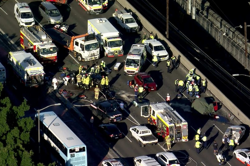 Shot from a helicopter, vision of cars and emergency services assisting