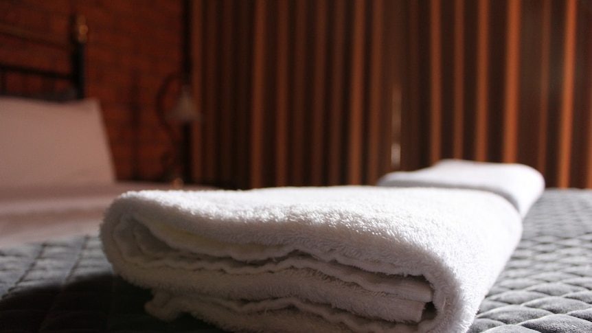 Towels on the bed of a hotel room in regional Victoria