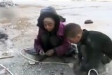 Children pick up breadcrumbs in Syria