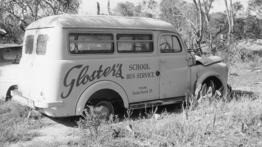 Black and white photo of old school bus
