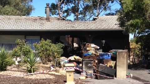 Police say a deliberately lit fire caused about $100,000 damage to this Flagstaff Hill house