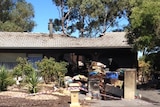 Police say a deliberately lit fire caused about $100,000 damage to this Flagstaff Hill house