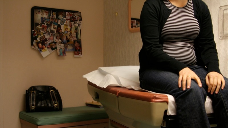 Pregnant woman in doctor's surgery