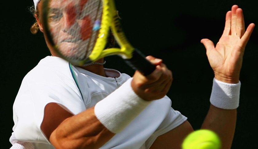 Lleyton Hewitt plays a forehand in the third round at Wimbledon against Guillermo Canas in 2007.