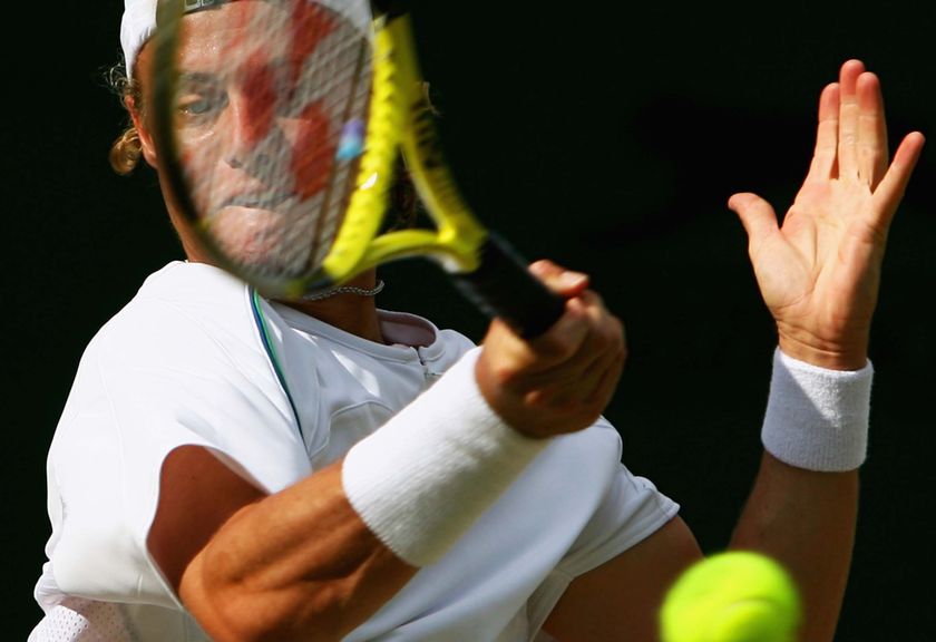 Lleyton Hewitt plays a forehand in the third round at Wimbledon against Guillermo Canas in 2007.