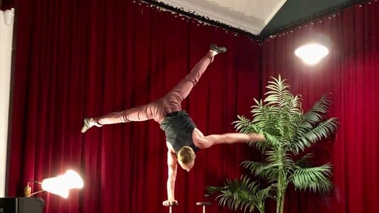 Balancing circus act pair performing on stage at former Salvation Army citadel in Murwillumbah