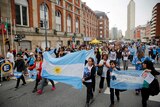 Relatives of crew members of the missing ARA San Juan submarine march through the streets of Mar del Plata