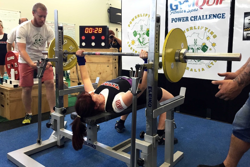 A powerlifting competitor attempts a bench-press at the Canberra event.