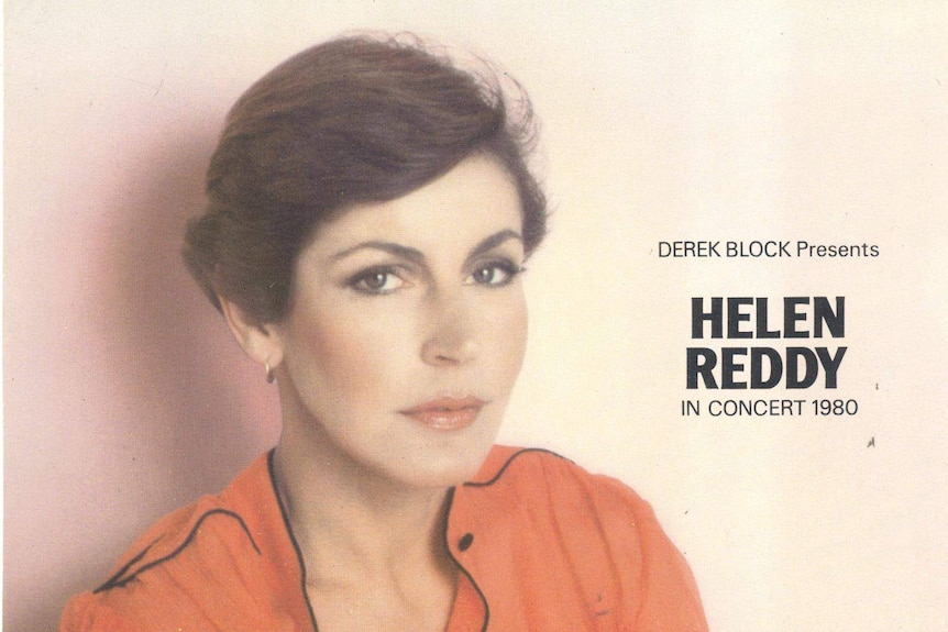 Helen Reddy wearing orange looking at the camera