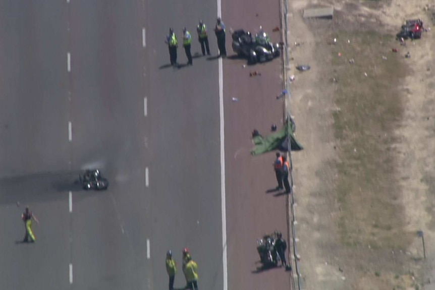 An aerial shot of police officers standing around motorcycles at a crash in Perth.