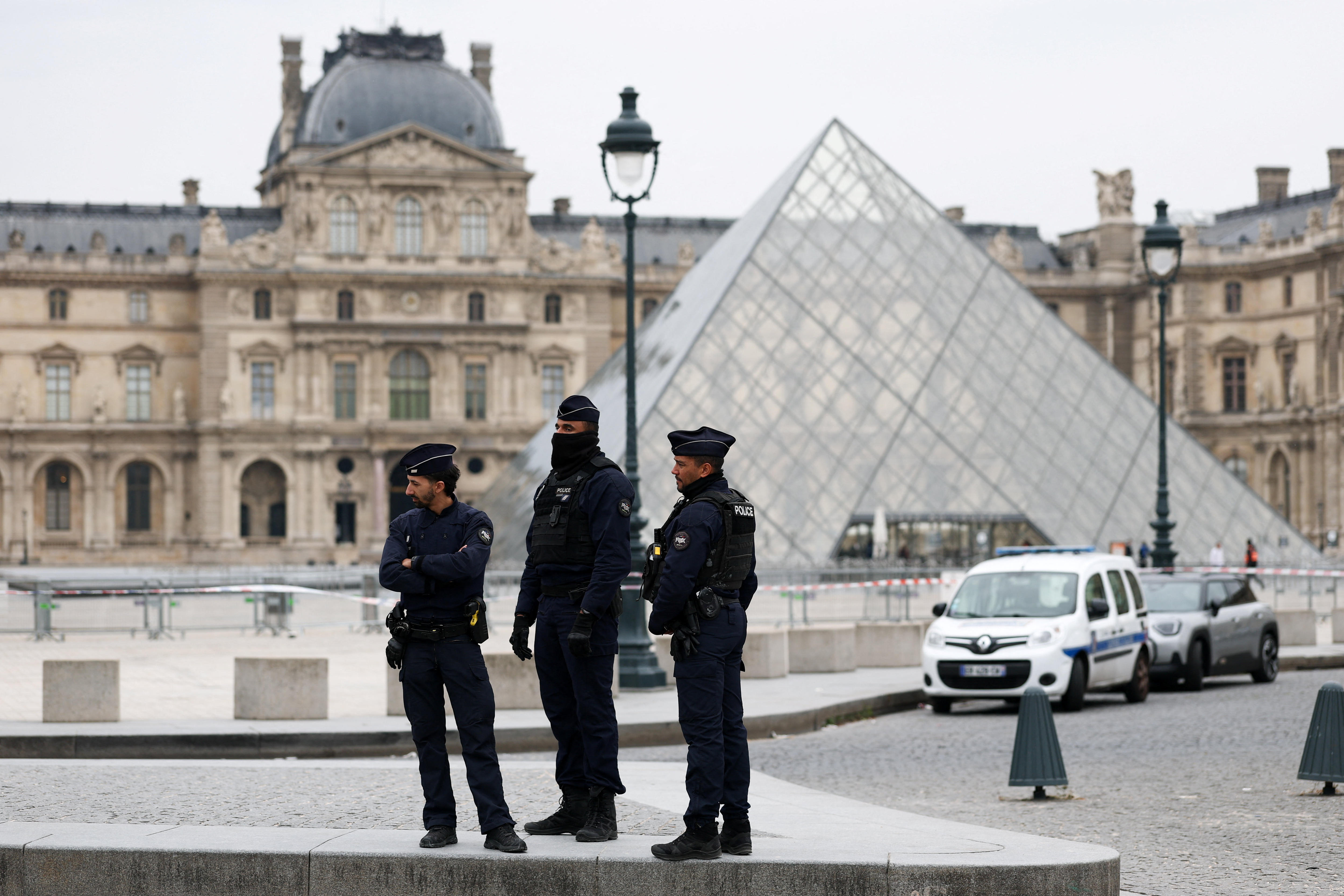 Three police officers outside the Louvre in Paris.