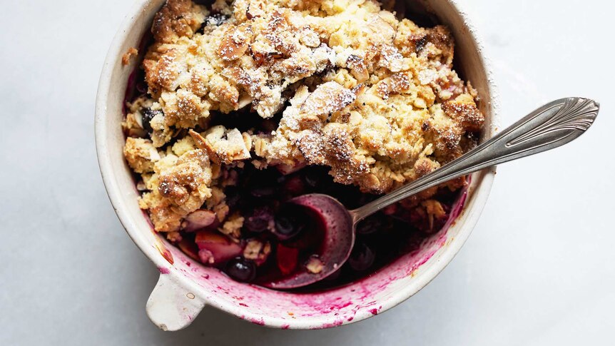 A close up of a pear and blueberry crumble, which makes a perfect for a spring dessert recipe.