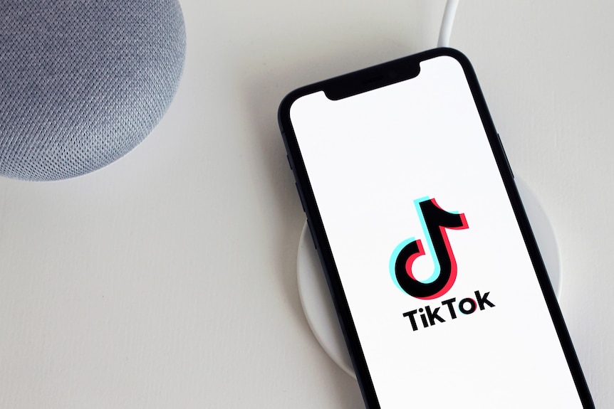 A phone with the TikTok logo displayed.