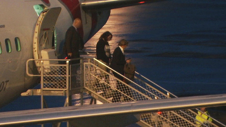 One of the accused arrives at Adelaide Airport