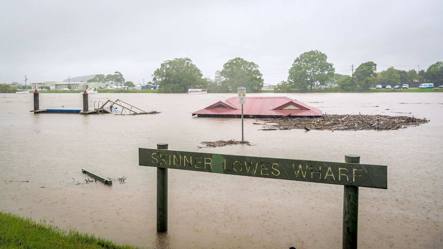 A building nearly completely submerged in water.