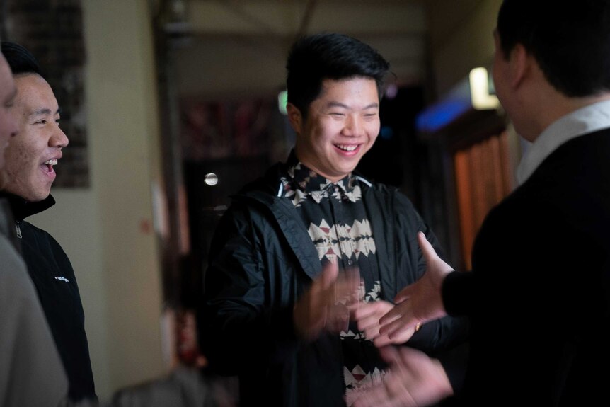 Anthony Hou hangs out with his friends in Sydney's Chinatown.