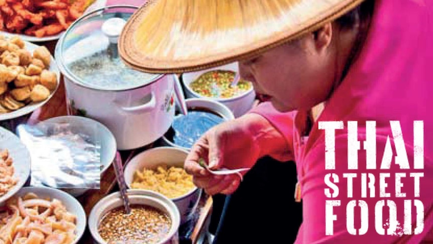 Woman sitting amongst an array of food