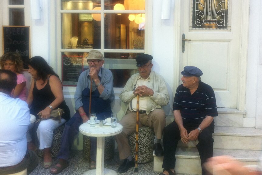 Locals outside cafe in Mykonos