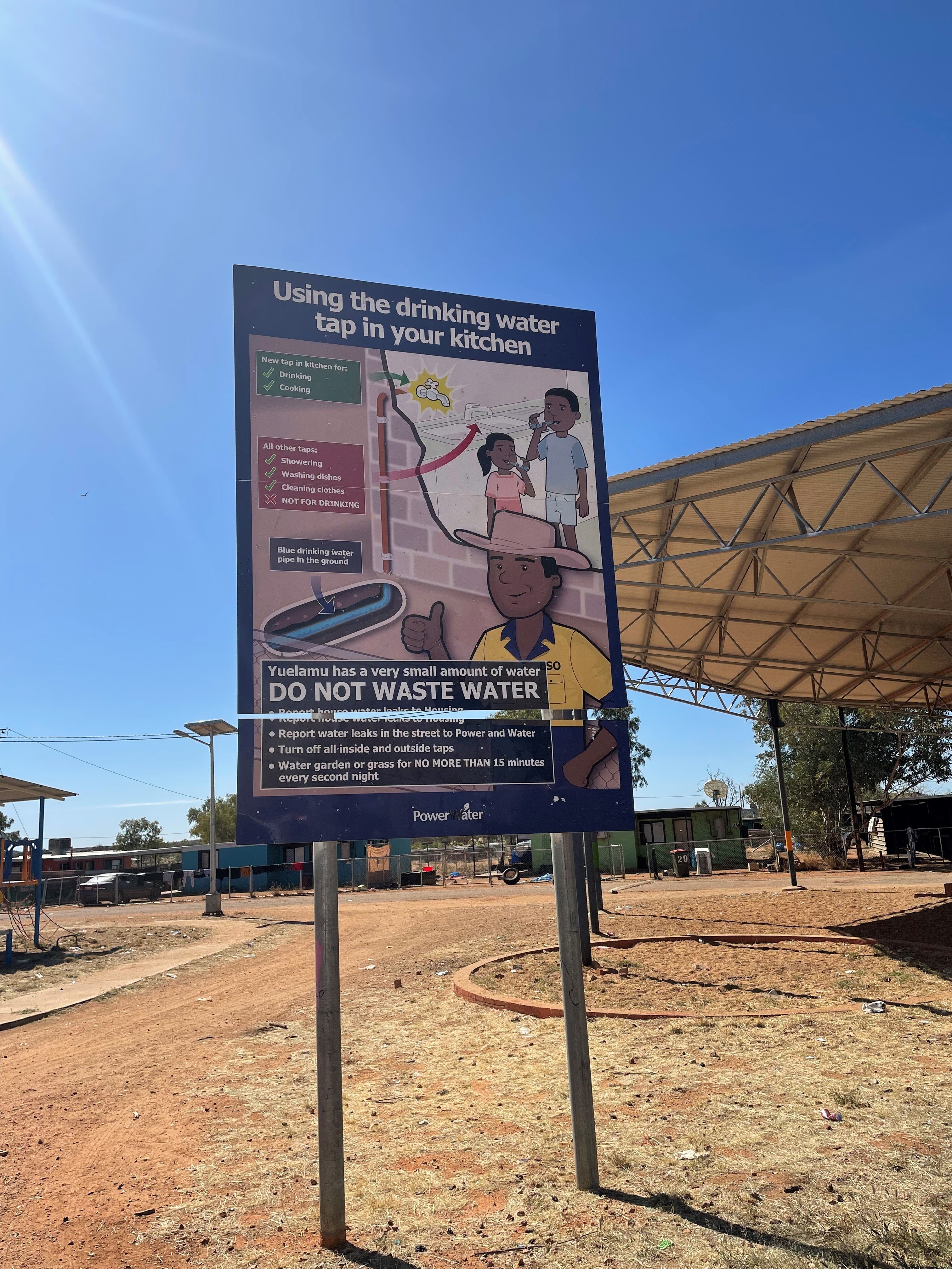 A sign in Yuelamu about using water wisely