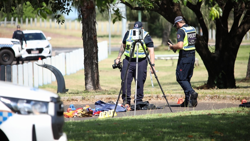 A photo showing Northern Territory police inspecting a hit and run scene in Birnkin
