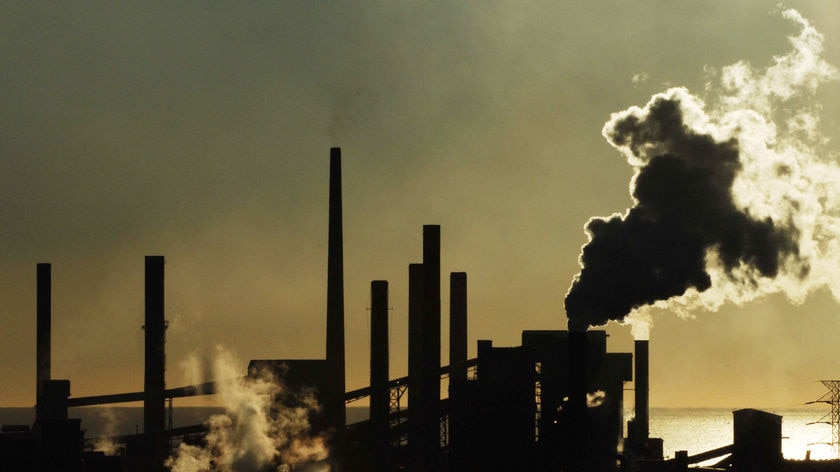 Industrial chimneys pouring out smoke.