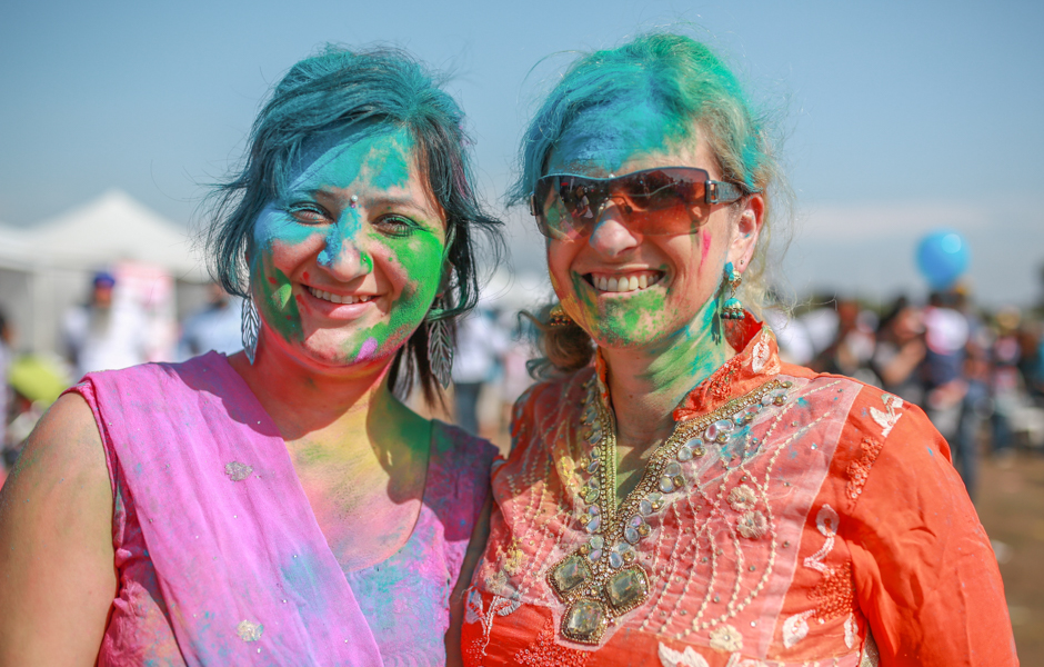 Friends Priyanka and Annie covered in coloured powder