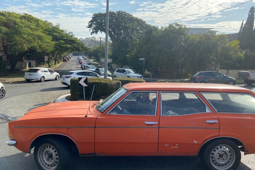 Cars banked up for kilometres and around round-abouts.