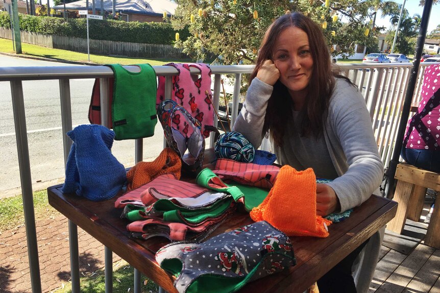 Mellissa Baker and her friends  meet at a Sunshine Coast cafe to knit the coats.
