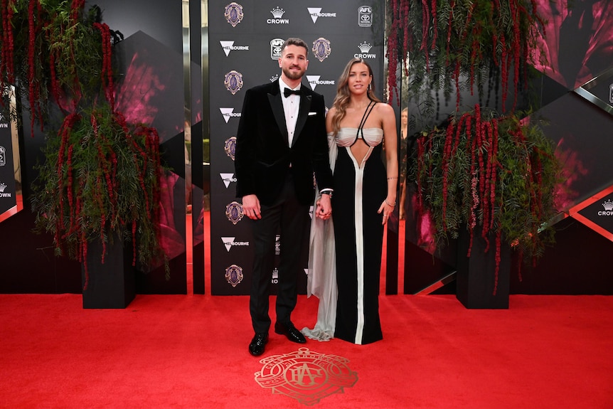 Black, white and gold for Western Bulldogs captain Marcus Bontempelli and his partner Neila Brenning