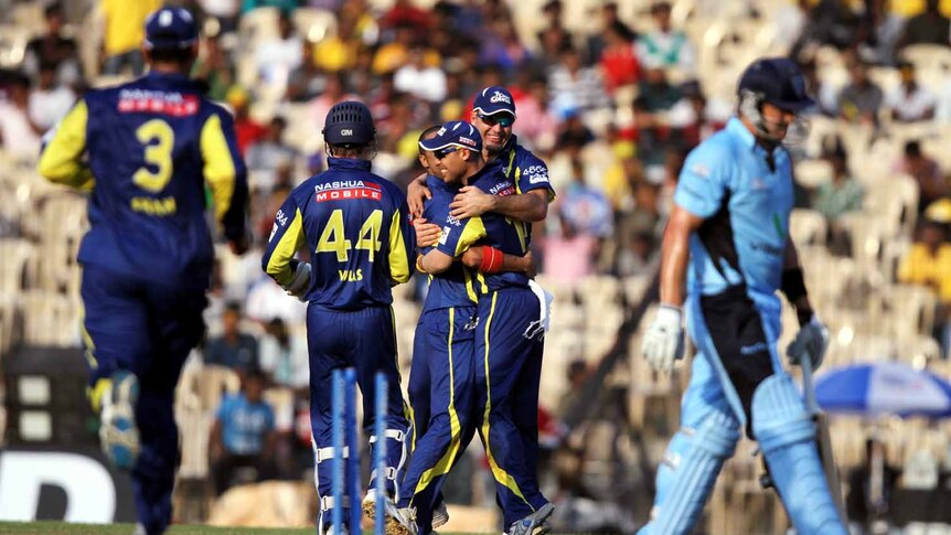 Champions League thumping ... the Cape Cobras celebrate after claiming the wicket of Shane Watson.