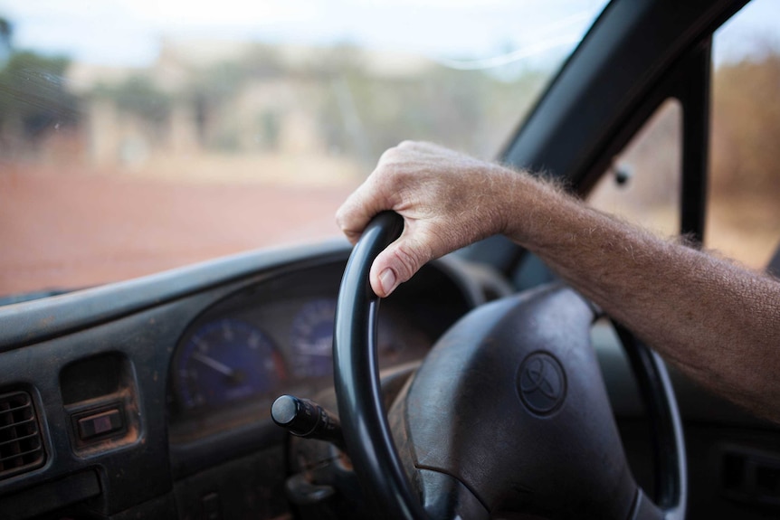 Damien McClean drives through Warburton, WA.