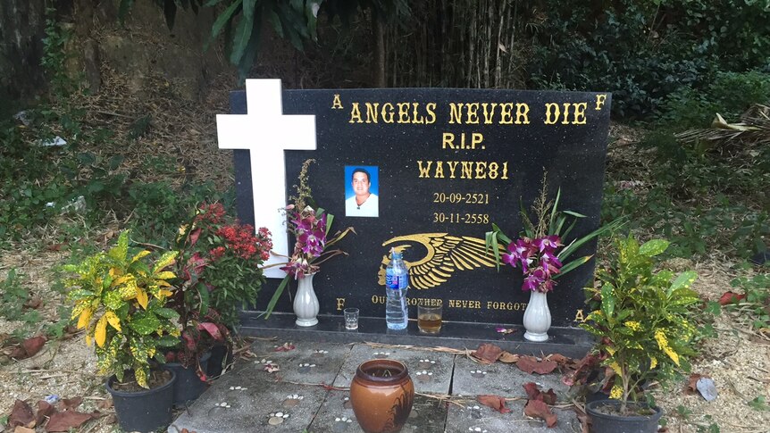 Large headstone with Christian cross, Schneider's picture and words: Angels Never Die, R.I.P Wayne81