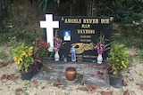 Large headstone with Christian cross, Schneider's picture and words: Angels Never Die, R.I.P Wayne81