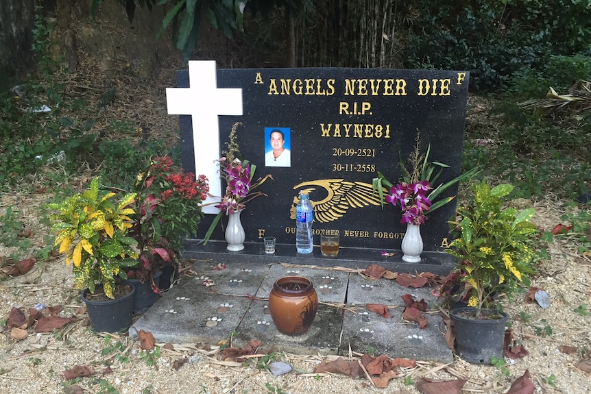 Large headstone with Christian cross, Schneider's picture and words: Angels Never Die, R.I.P Wayne81