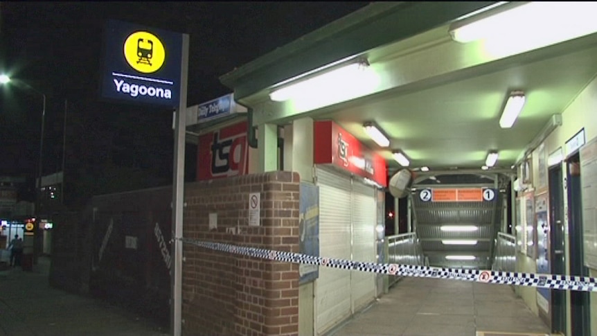 Police tape at the entrance to Yagoona train station