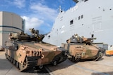 Two Australian army infantry fighting vehicles. 