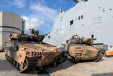 Two Australian army infantry fighting vehicles. 