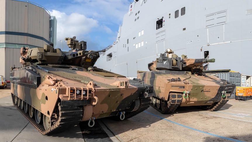 Two Australian army infantry fighting vehicles. 