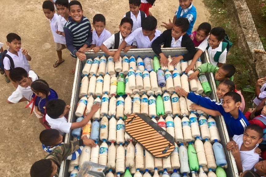 Kids celebrate their plastic bottle business